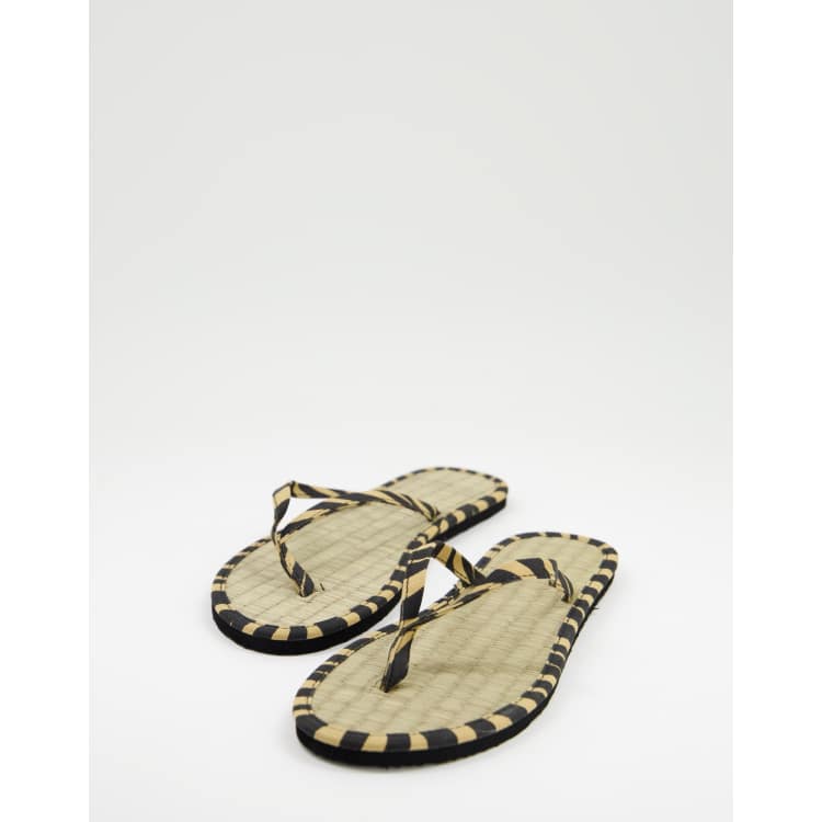 Accessorize seagrass flip flops in animal ASOS