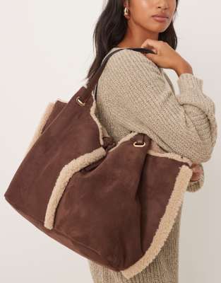 Accessorize Accessorize shearling and faux suede reversible shoulder bag in brown-White