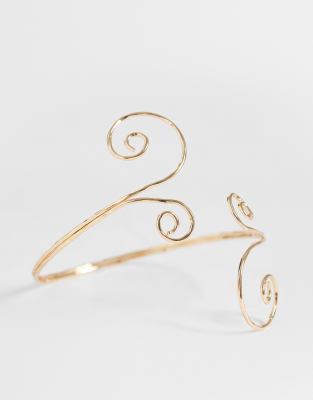 swirly arm cuff in gold tone