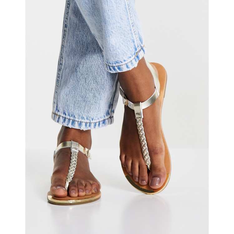 Accessorize t bar sandals with plait detail in gold ASOS