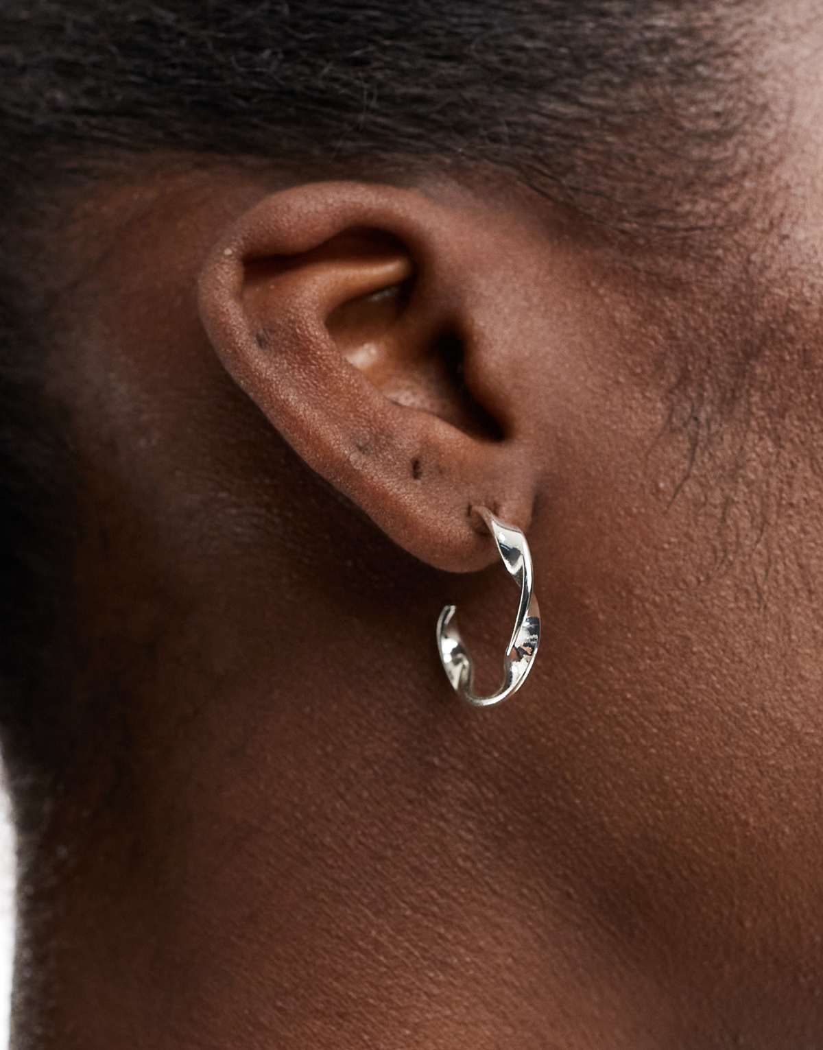 Accessorize twisted hoop earrings in plated stainless steel