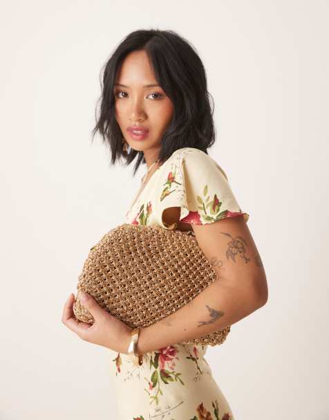 Accessorize woven metallic clutch in gold - view 1