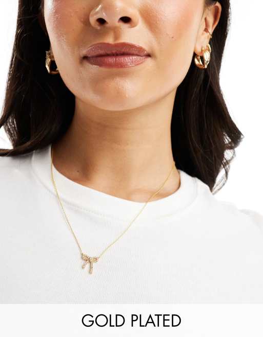 Accessorize - Z Collection - Collana placcata oro con ciondolo a fiocco con cristalli