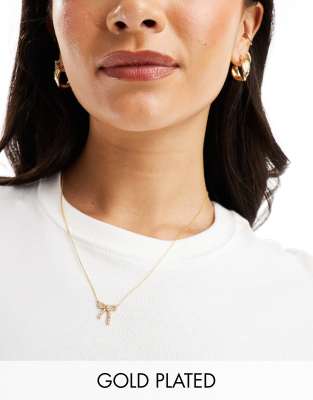 Accessorize Z Collection crystal bow pendant necklace in gold plated