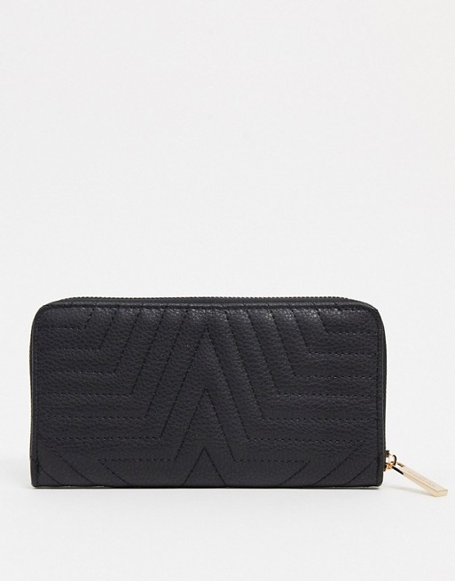 Accessorize zip purse in black star motif