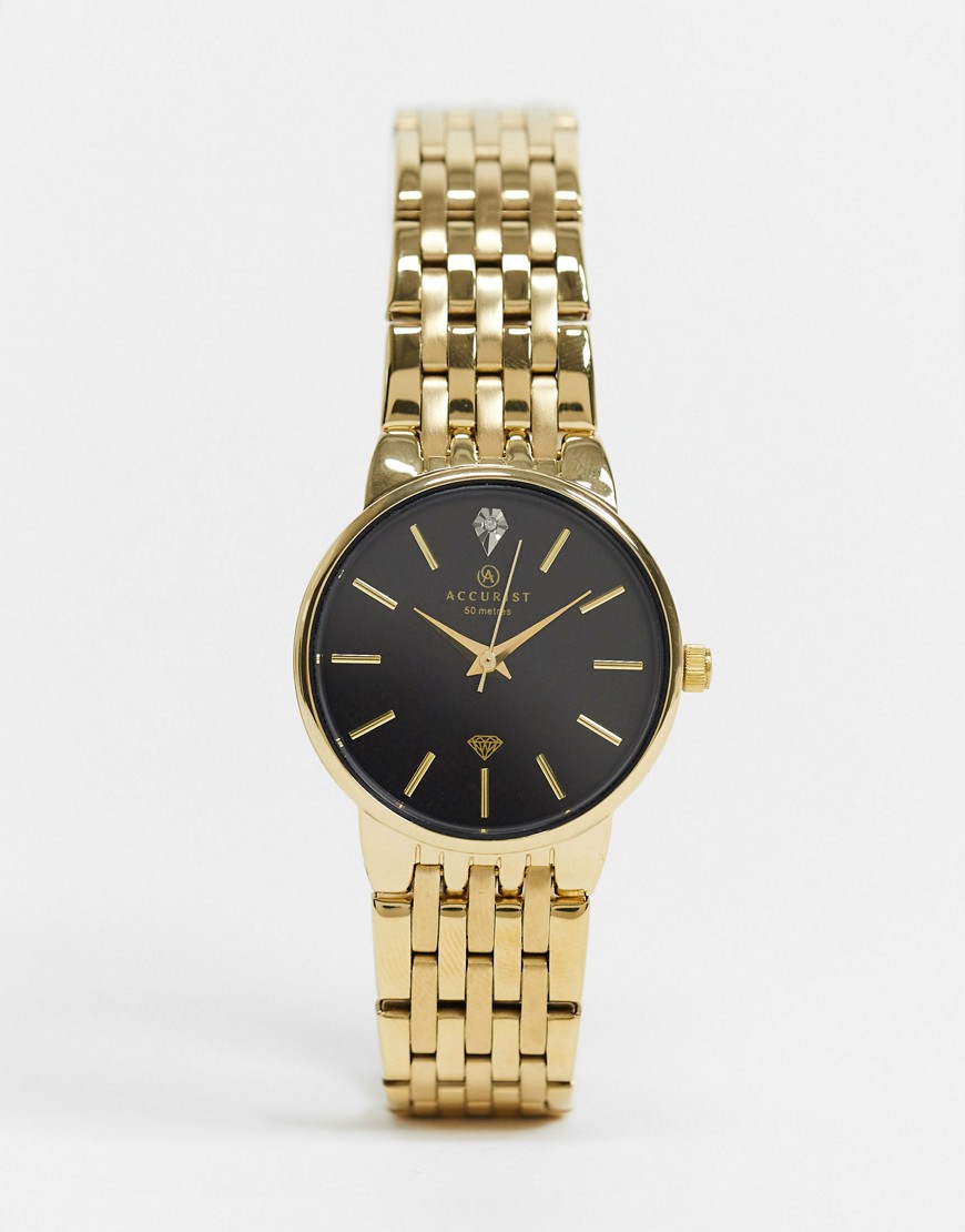 Accurist – Guldfärgad armbandsklocka med svart urtavla