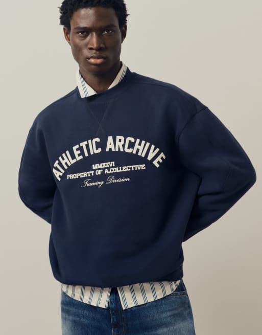 A.Collective heavyweight crew neck sweater with chest print in navy, 4 of 9