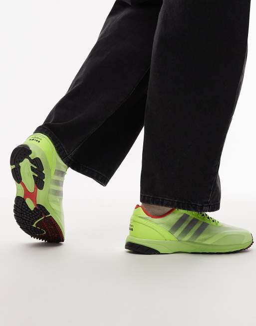 adidas Adios OG trainers in yellow and black, 3 of 5