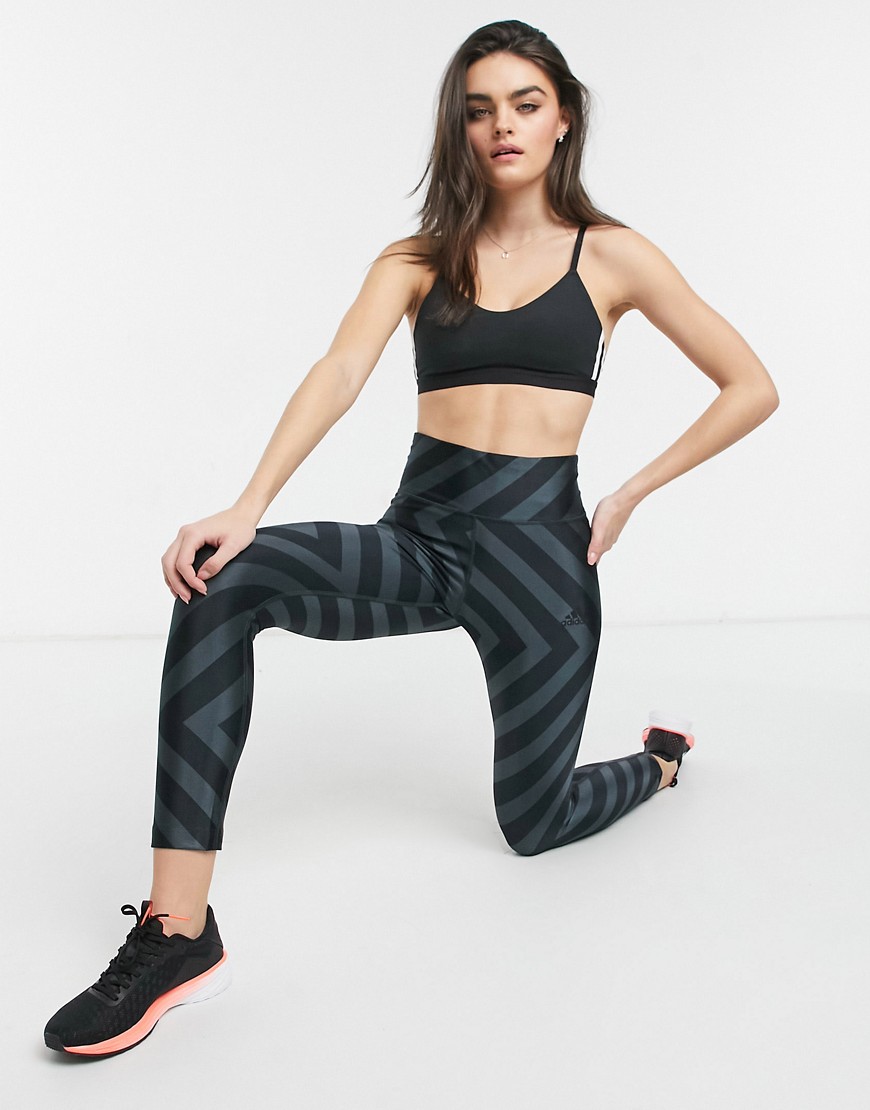 Adidas All over graphic tights in black