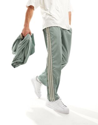 adidas Basketball joggers in silver green