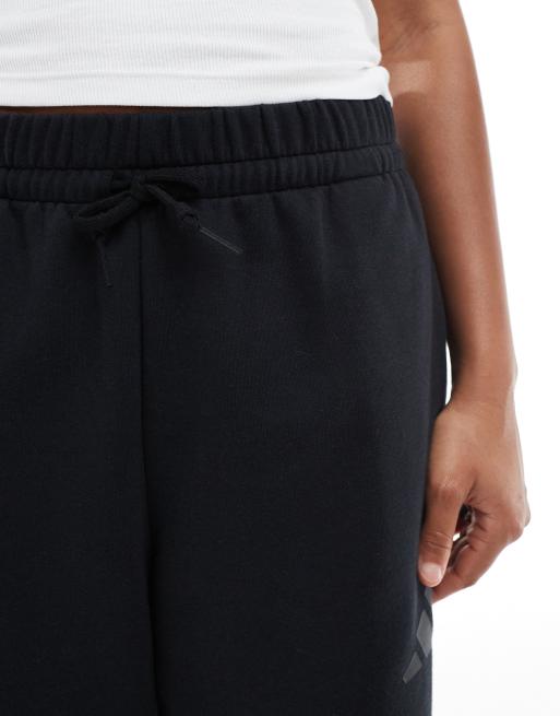 adidas Essentials – Czarne baryłkowe spodnie podszyte polarem z logo, 3 z 5