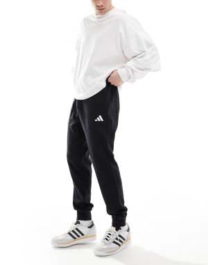 adidas Essentials feel cozy french terry pants in black / white - BLACK