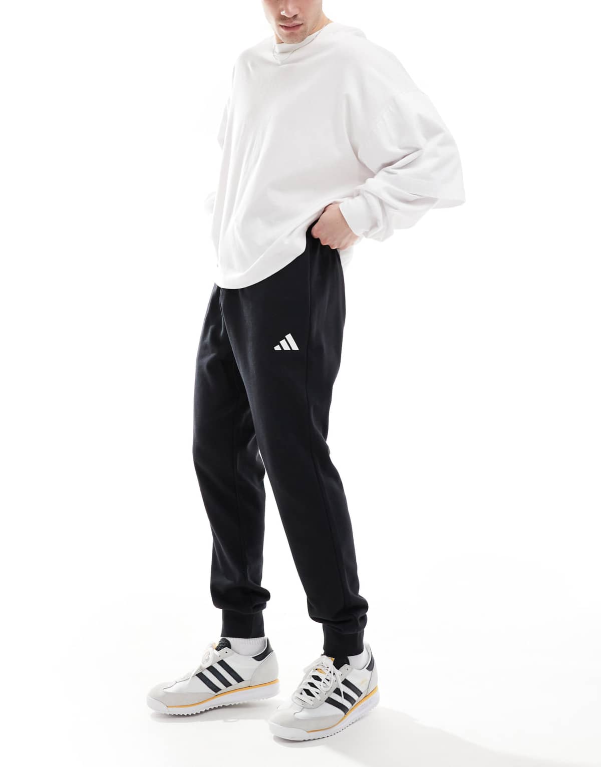 adidas Essentials feel cozy french terry pants in black / white