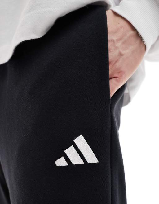 adidas – Essentials Feelcozy – Hose aus French Terry in Schwarz/Weiß, 4 von 5