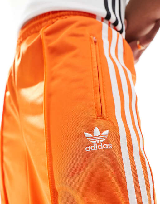 adidas Firebird Loose Tracksuit Bottoms in orange