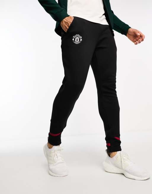 Manchester united black store tracksuit