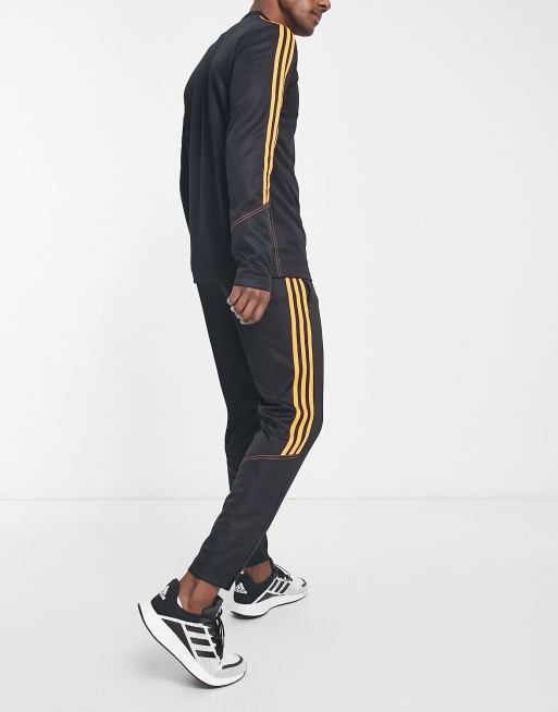 Tuta adidas store nera arancione