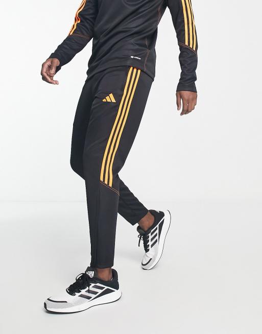 adidas Football Tiro track pants in black, ASOS