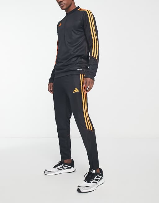 adidas Football Tiro track pants in black, ASOS