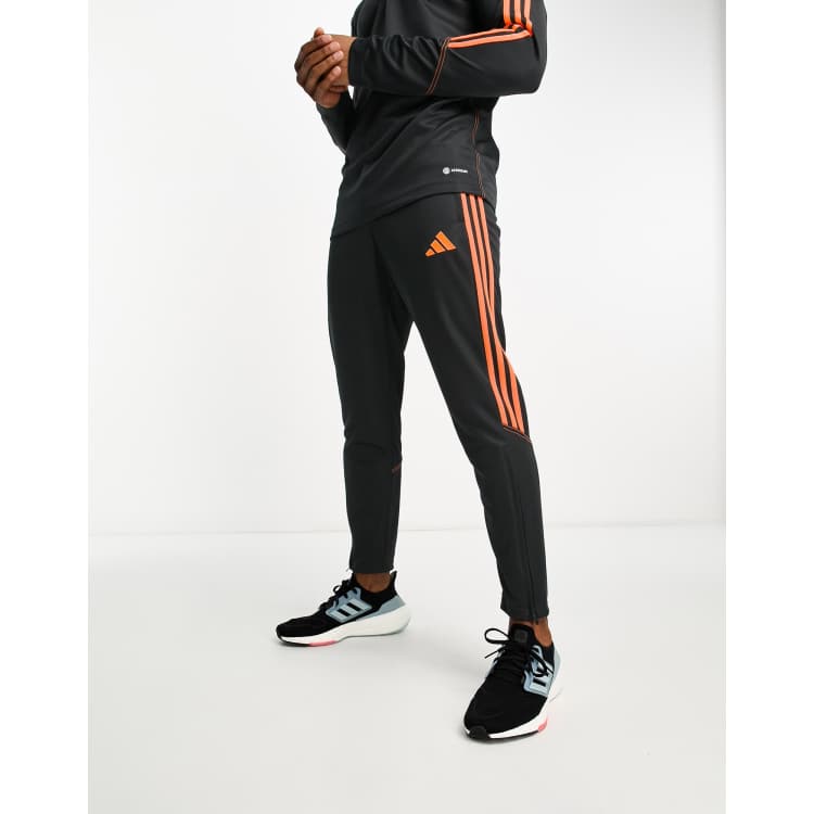 adidas Football Tiro 23 joggers in black and orange ASOS