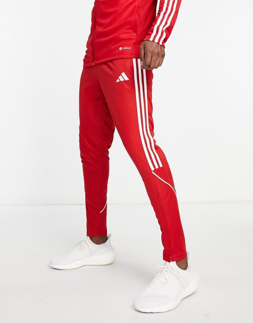 Red and white store adidas sweatpants