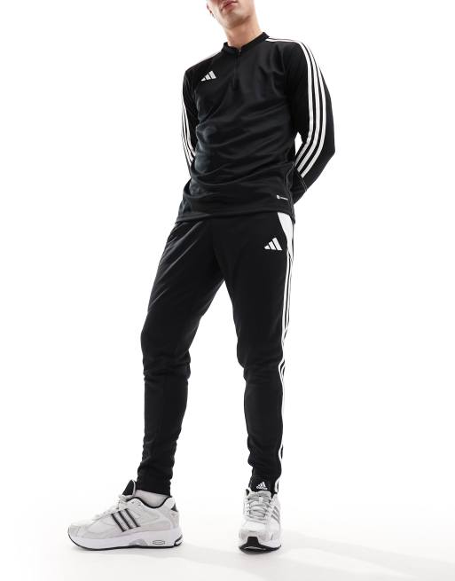 adidas Football Tiro track pants in black, ASOS