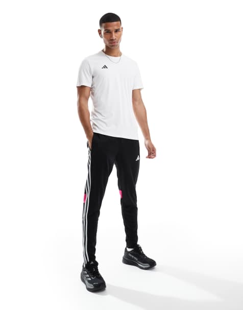 adidas Football Tiro essentials 3 stripe joggers in black - view 1