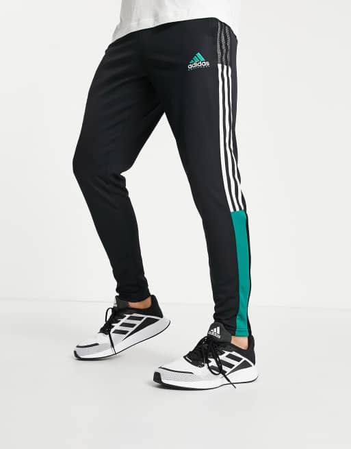 Black adidas best sale with green stripes