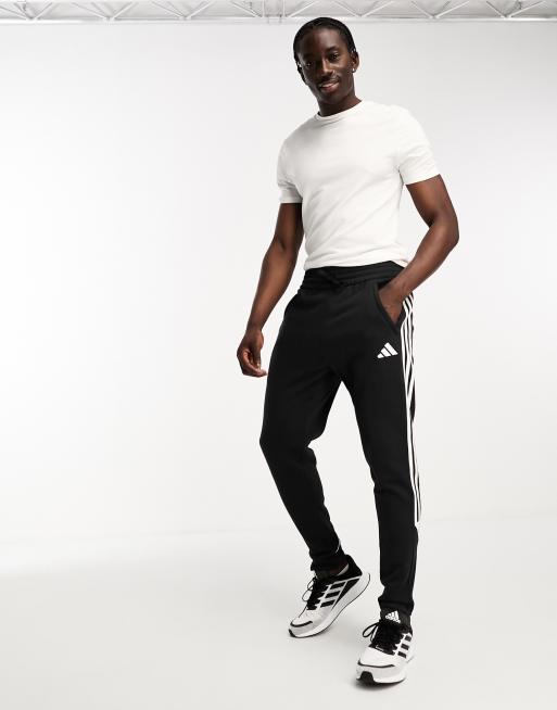 Adidas training 3 stripe tiro joggers in black sale