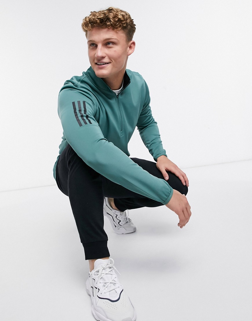 Adidas - Golf - Sweatshirt met halve ritssluiting en drie strepen in groen