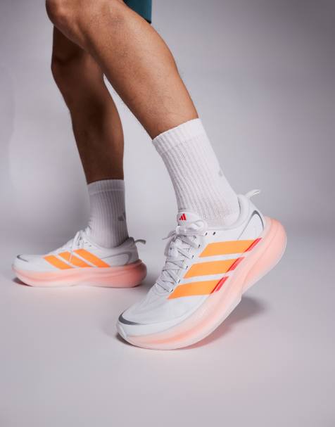 adidas - Hardlopen - Supernova Glide - Sneakers in wit en oranje - view 1