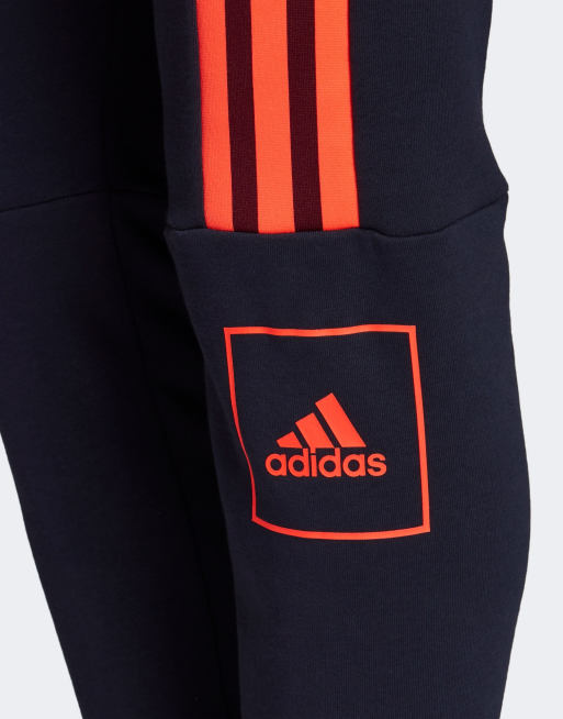 Survetement adidas shop bleu et orange