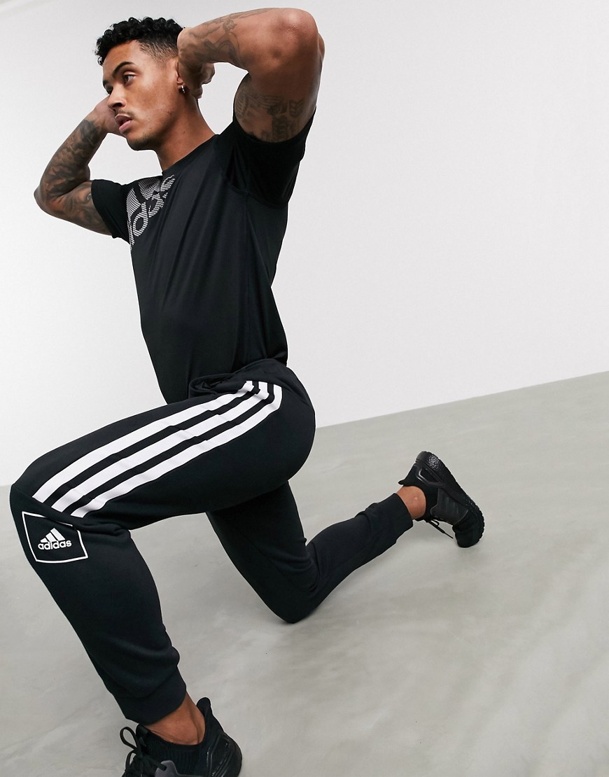 Adidas - Joggers skinny neri con 3 strisce-Nero
