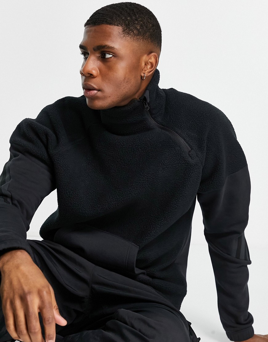 adidas long sleeve top with front pocket and three stripes in black