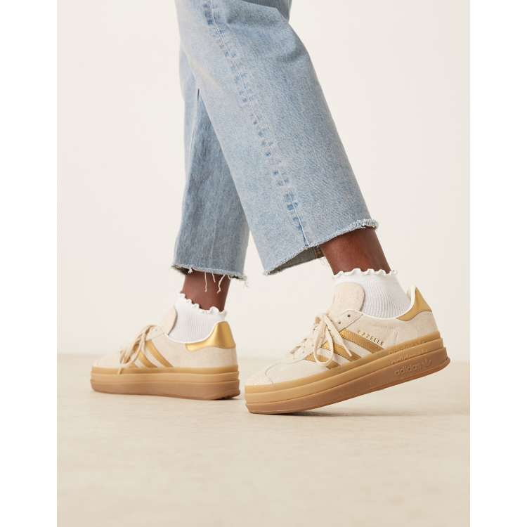adidas Orginals Gazelle Bold trainers in off white and metallic gold stipes  | ASOS