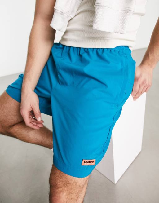 adidas Origianls Adventure logo woven shorts in blue