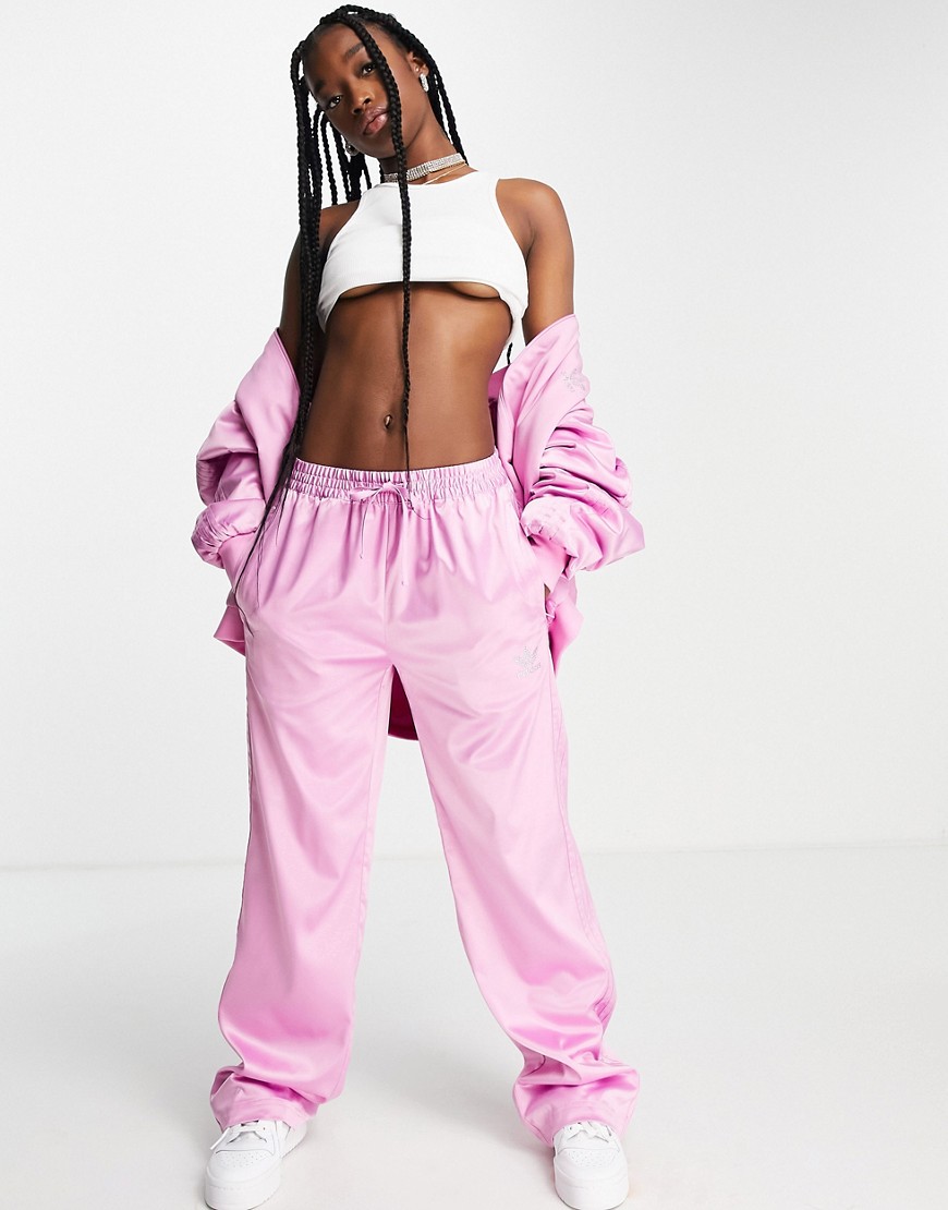 adidas Originals '2000s Luxe' satin wide leg pants in pink with rhinestone logo