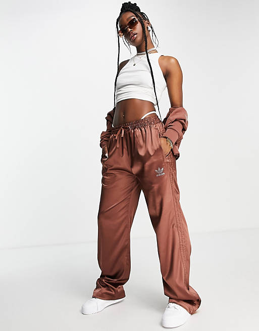 adidas Originals '2000s Luxe' satin wide leg trousers in brown with diamante logo