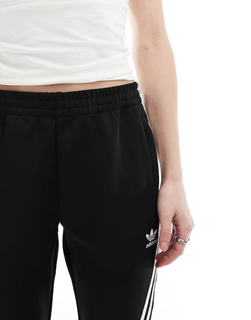 Adidas originals three stripe flared track pants in black deals