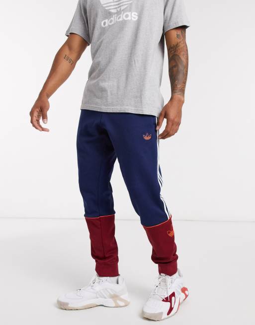 adidas originals joggers with logo embroidery in burgundy