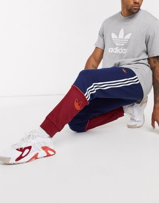 adidas originals three stripe track pants in burgundy