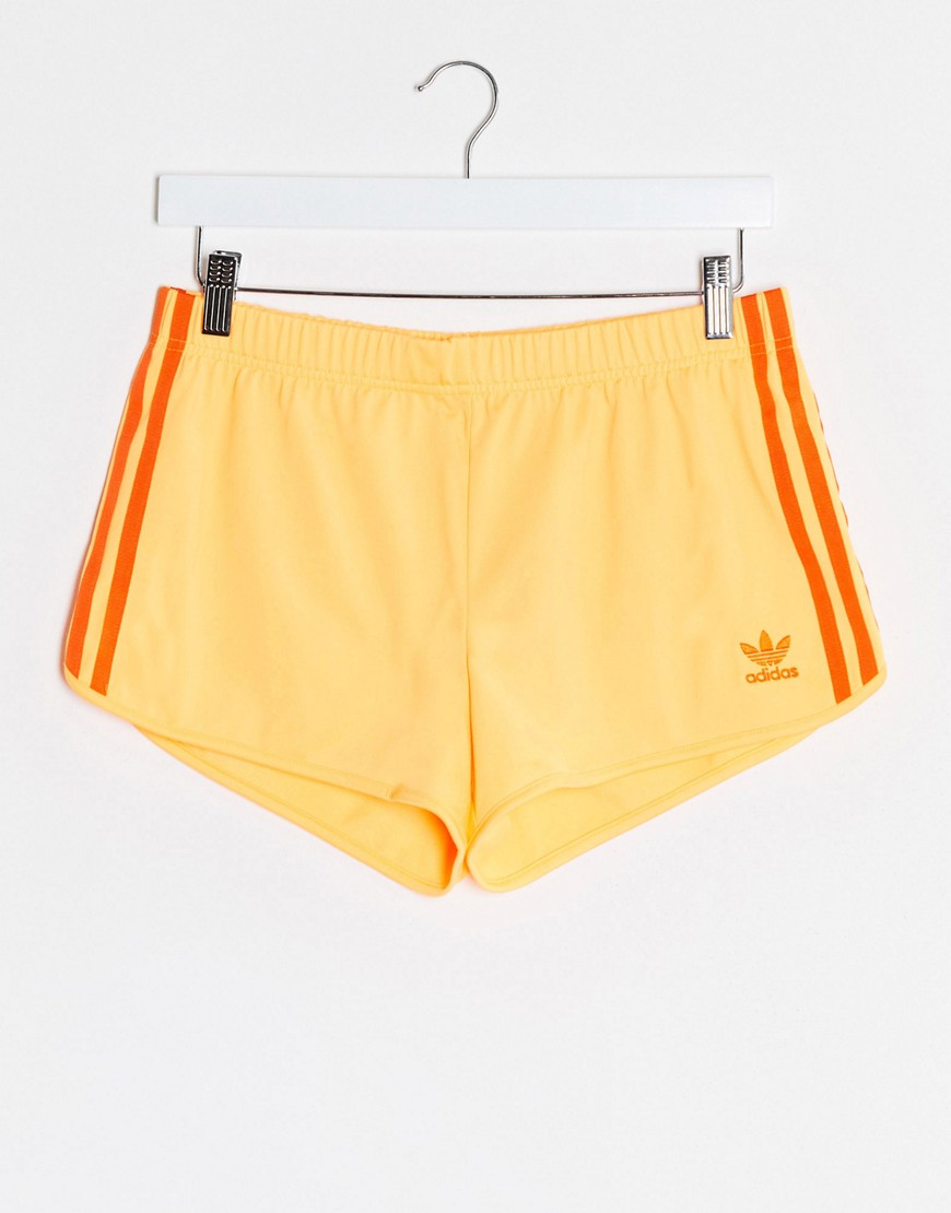 Adidas Originals 3 stripe shorts in orange