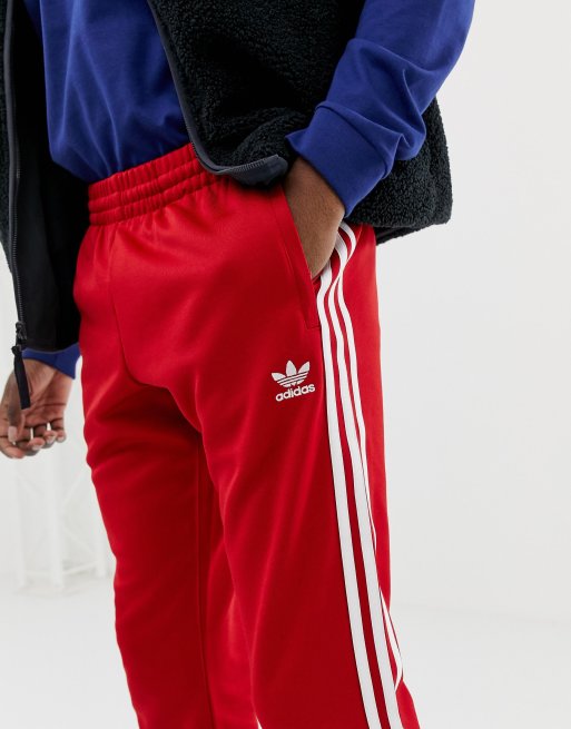 adidas Originals 3 stripe skinny joggers with cuffed hem DV1534 red