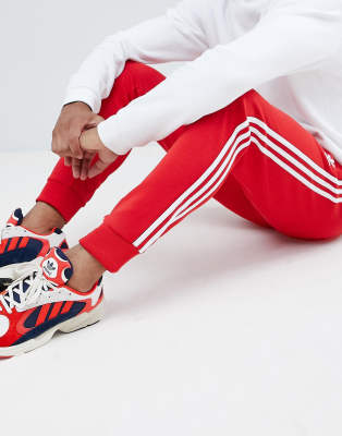 adidas Originals 3-stripe skinny joggers with cuffed hem in red DH5837 |  ASOS