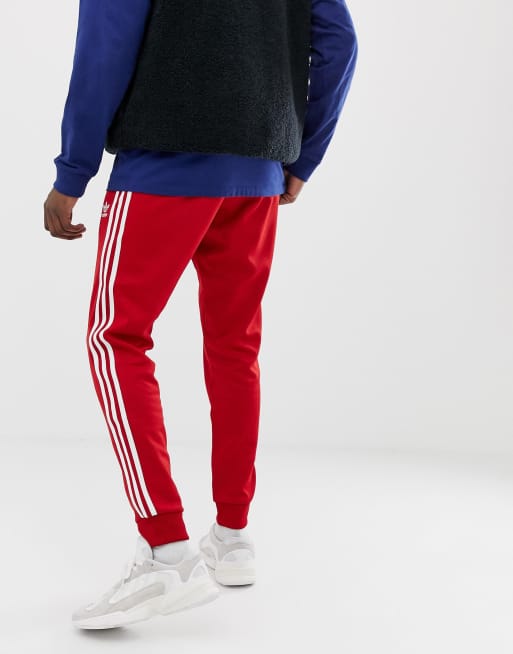 adidas Originals 3-stripe skinny sweatpants with cuffed hem DV1534 red