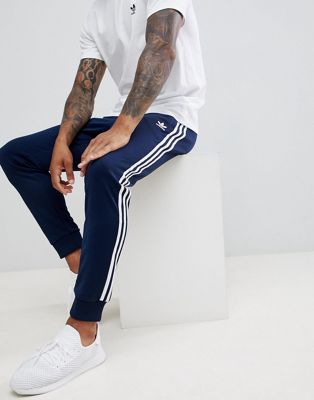 adidas Originals 3-stripe skinny sweatpants with cuffed hem in navy DH5834  | ASOS
