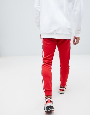 adidas Originals 3-stripe skinny sweatpants with cuffed hem in red DH5837 |  ASOS