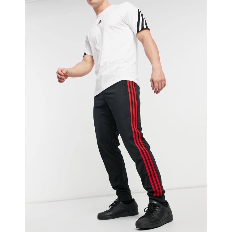 Black with red shop stripe adidas pants