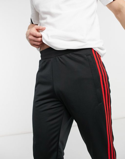 adidas Originals 3 Stripes Firebird sweatpants in black and red ASOS