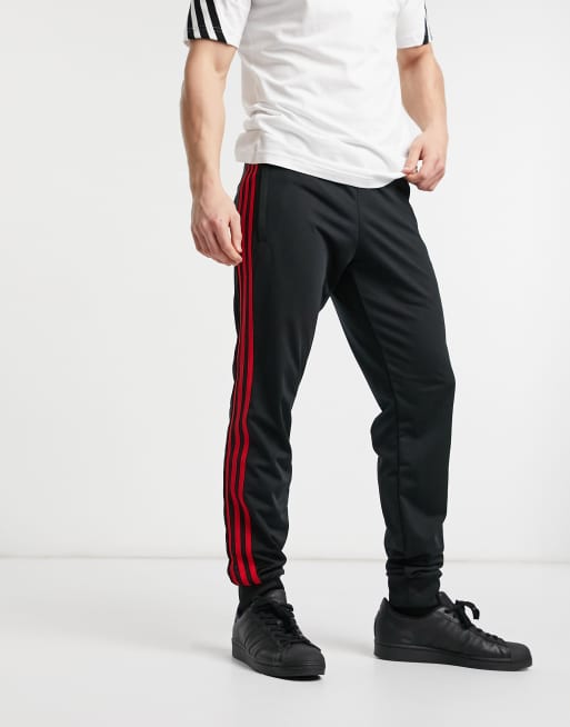 Black sweatpants with outlet red stripe